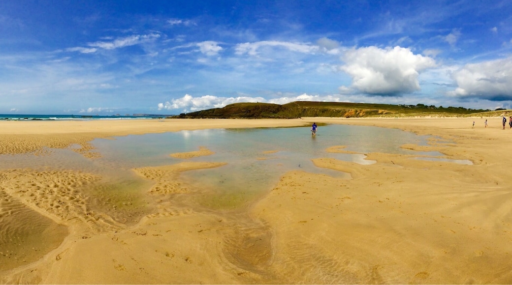 Surfers' beach - unsafe for swimming, but lots of people ignore this. Sand stretches forever at low tide. Walk uphill to see prehistoric standing stones.