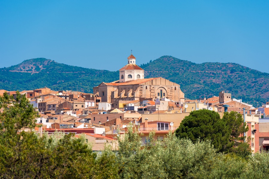 View of Mont-roig del Camp and the church of St. Miguel, Tarragona, Catalunya, Spain. Copy space for text