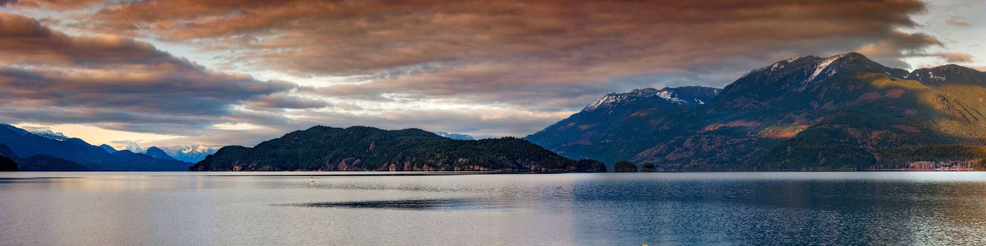 Boat Dock on Harrison Lake at Sunset. Harrison Lake is the largest lake in the southern Coast Mountains of Canada and home to the historic Harrison Hot Springs Resort.