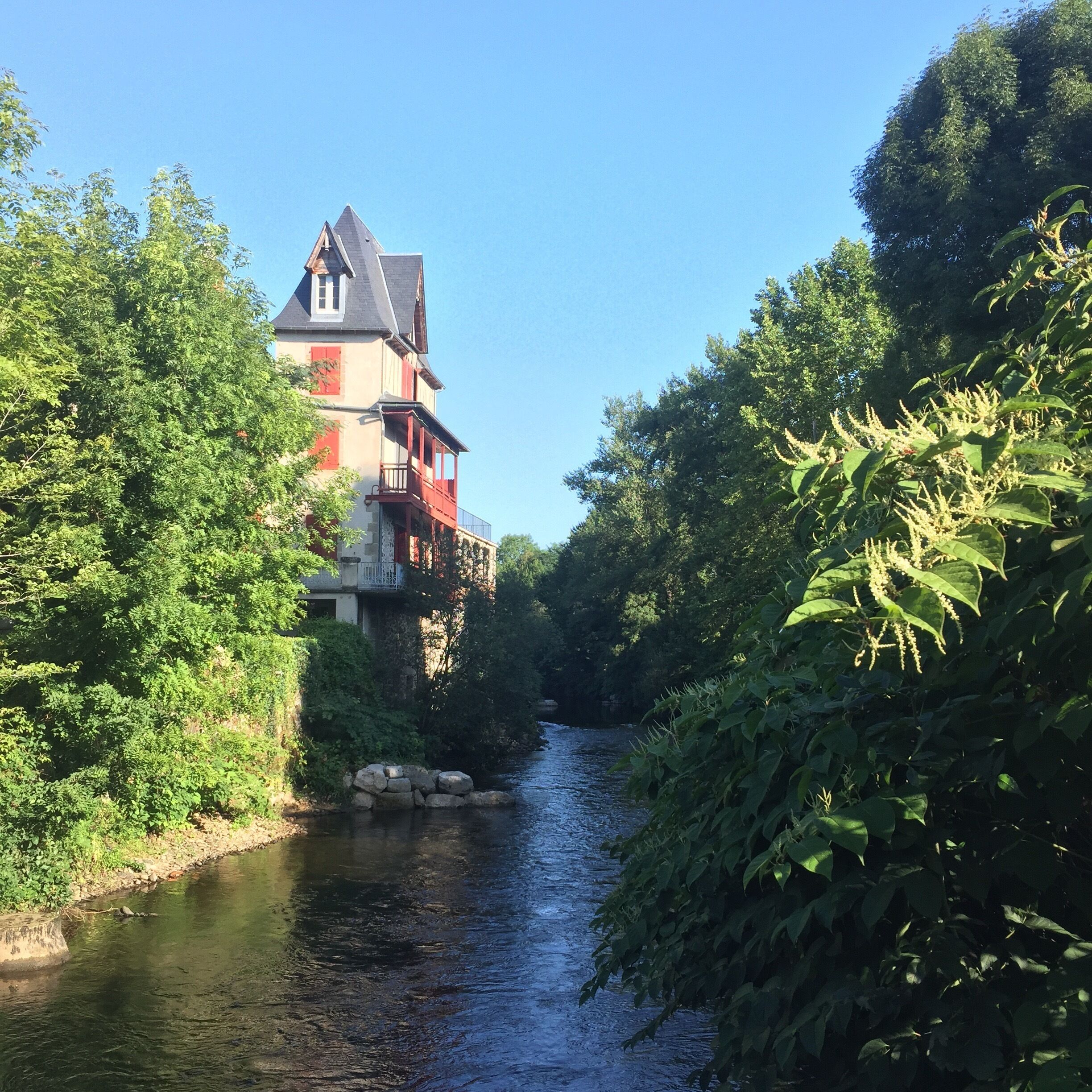 Campsite Huttopia is located on a small island in the river Dordogne, access by small lovely bridge with beautiful views.