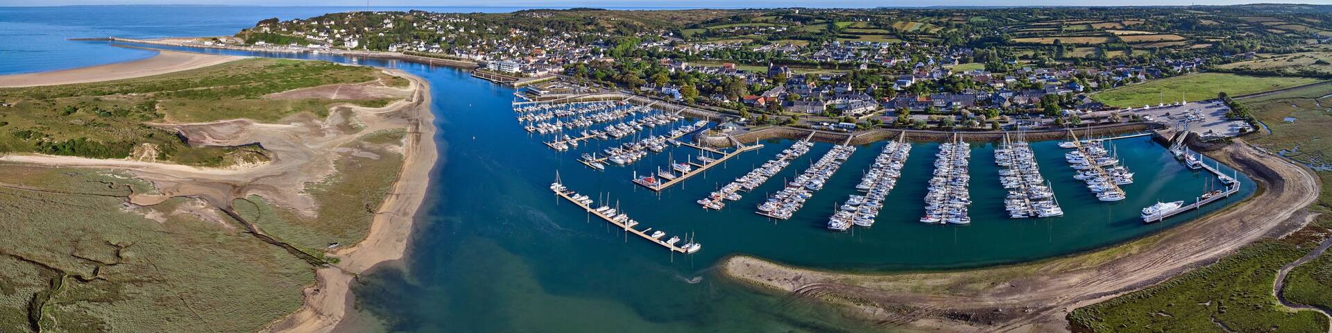 Aerial panoramic image of Carteret marina and estuary on a sunny day in France