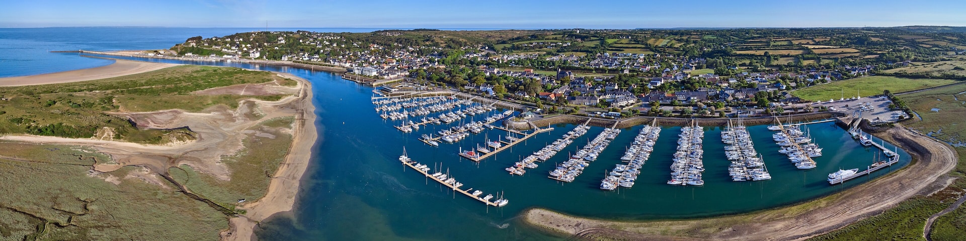 Aerial panoramic image of Carteret marina and estuary on a sunny day in France