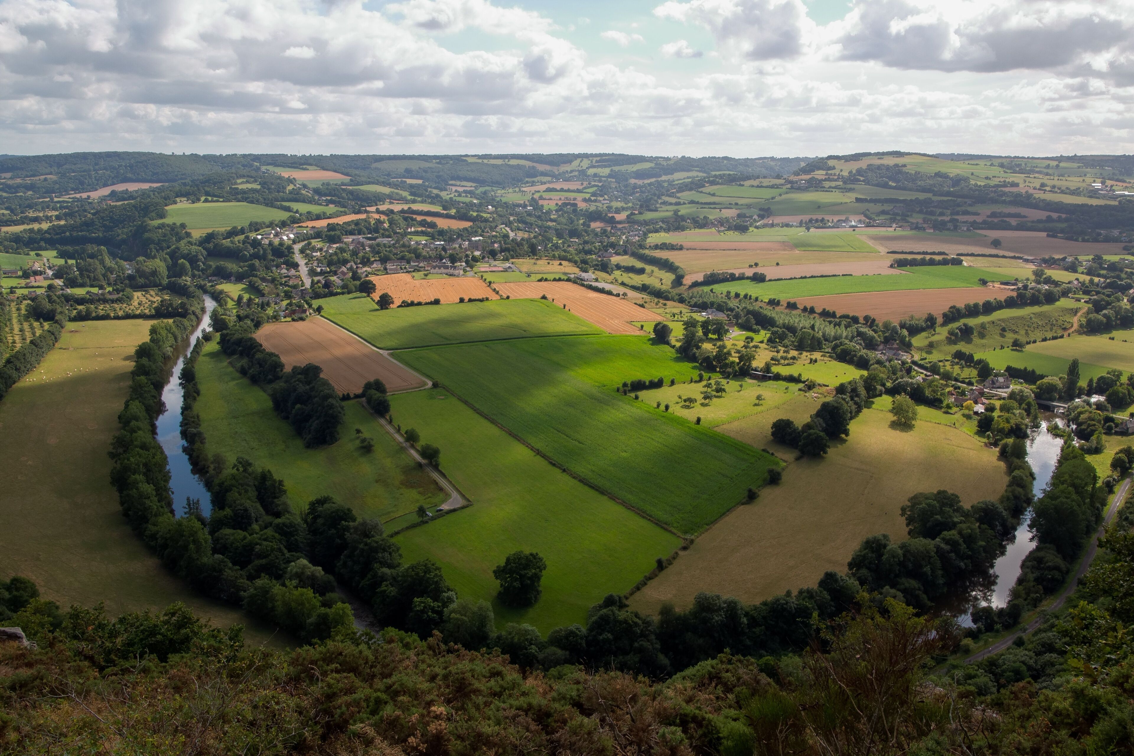 Aerial view of Clecy village with green fields, Swiss Normandy, Normandy, France
