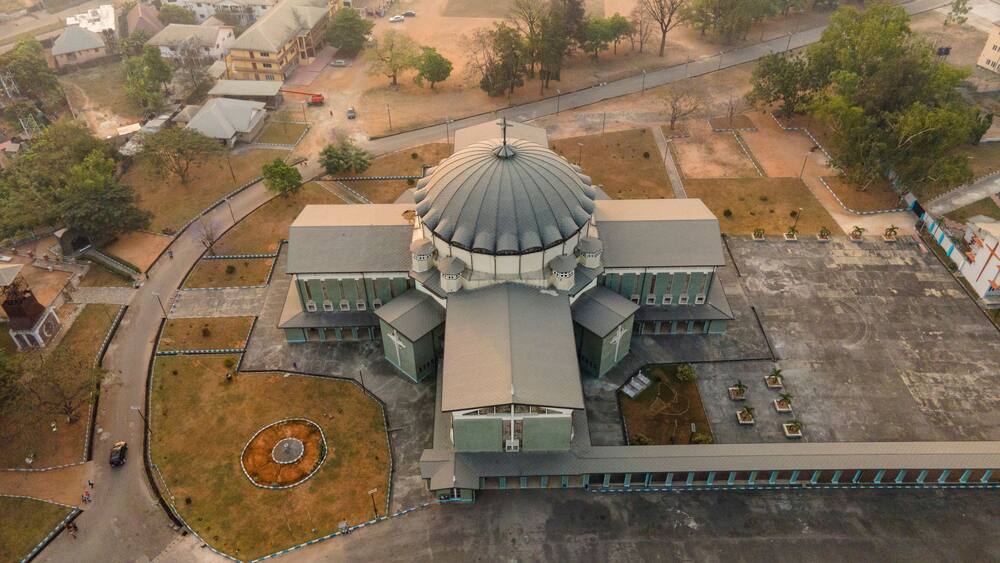 Aerial view of historical buildings and sacred temples in a vibrant urban landscape, Owerri Municipal, Nigeria.