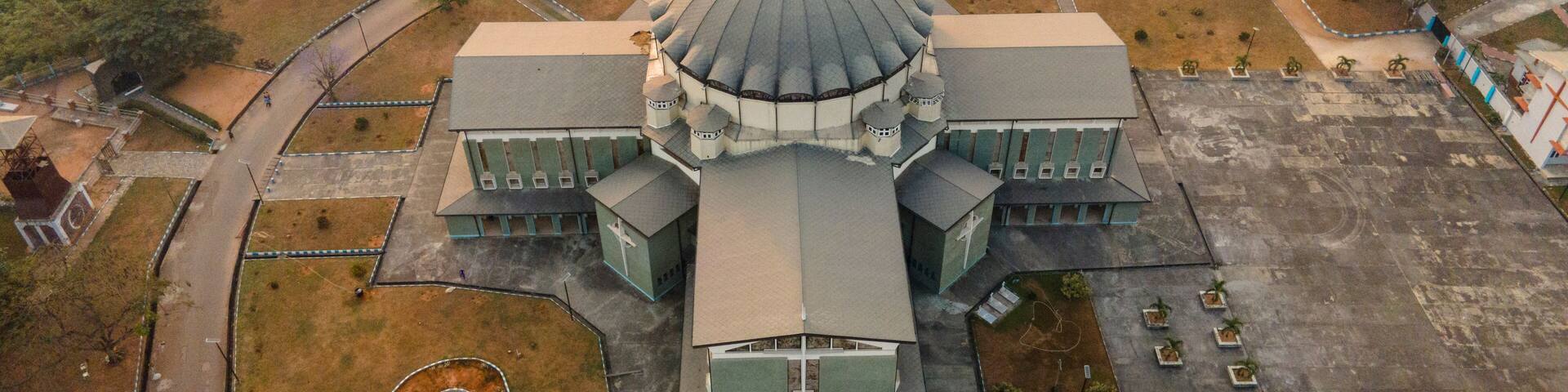 Aerial view of historical buildings and sacred temples in a vibrant urban landscape, Owerri Municipal, Nigeria.