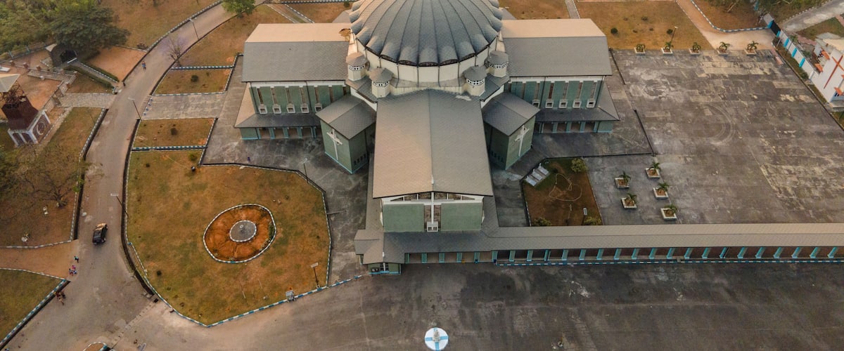 Aerial view of historical buildings and sacred temples in a vibrant urban landscape, Owerri Municipal, Nigeria.