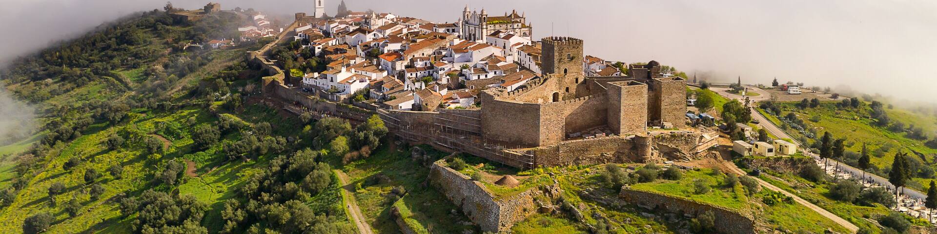 Monsaraz drone aerial view on the clouds in Alentejo, Portugal