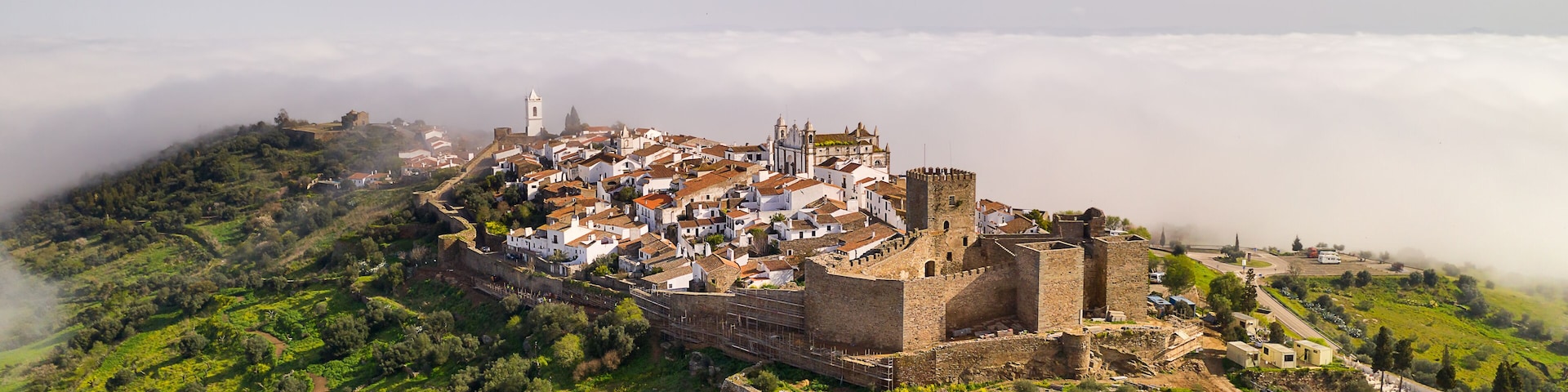 Monsaraz drone aerial view on the clouds in Alentejo, Portugal