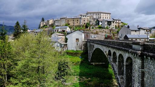Bridge over the Agout river, leading to the perched village of La Salvetat-sur-Agout.