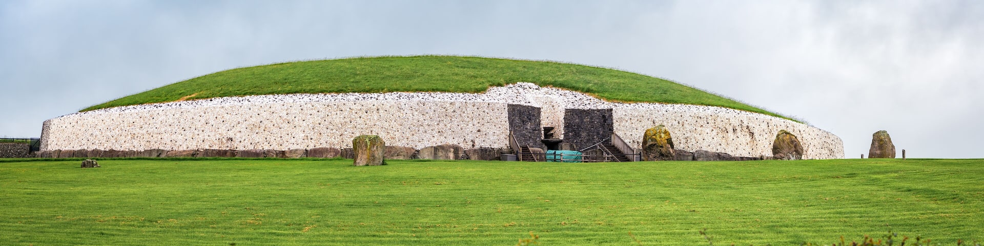 Drogheda, Ireland - July 15, 2020: Panoramic view of Newgrange prehistoric monument which is older than Stonehenge and the Egyptian pyramids.