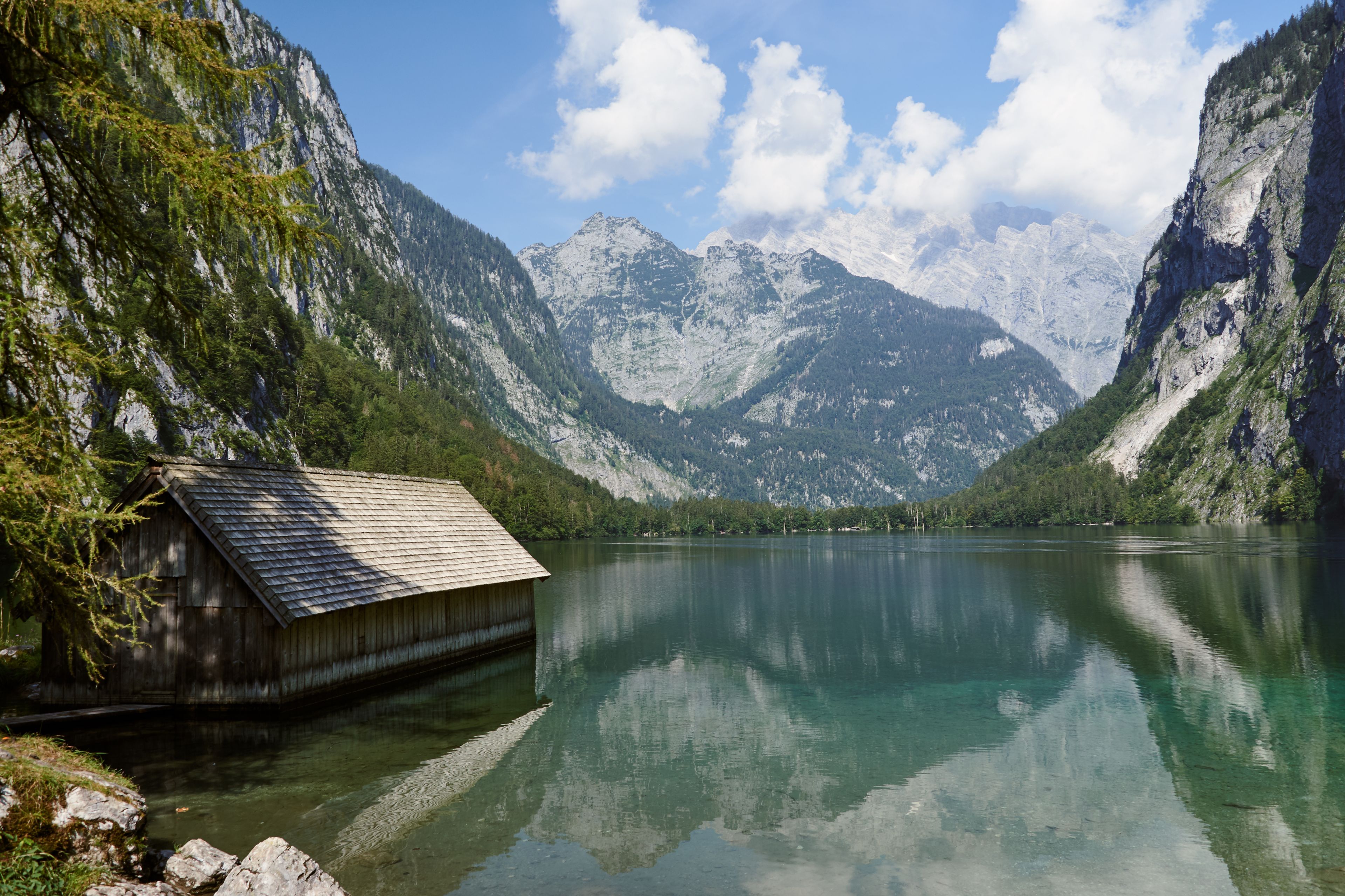Boathouse at lake Obersee and scenic landscape in Schoenau am Koenigssee, Bavaria, Germany