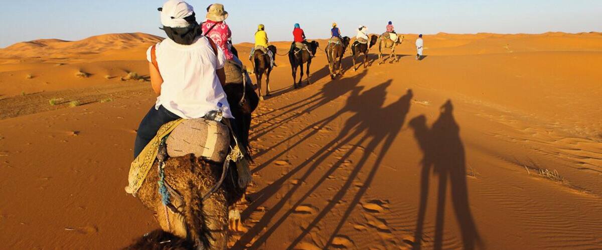We quietly began our trek to our desert camp.
All that could be heard was the sand swishing as the camels took a step.
Our caravan of 9 led by our 2 amazing camel men, continued to the desert, where sunset was waiting for us.
Absolutely breathtaking.