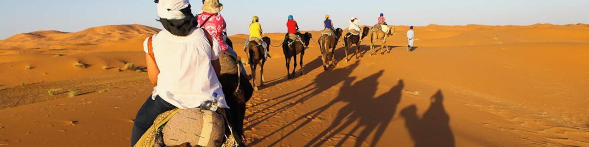 We quietly began our trek to our desert camp.
All that could be heard was the sand swishing as the camels took a step.
Our caravan of 9 led by our 2 amazing camel men, continued to the desert, where sunset was waiting for us.
Absolutely breathtaking.