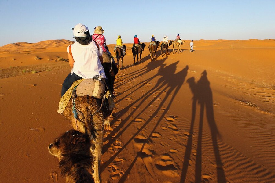 We quietly began our trek to our desert camp.
All that could be heard was the sand swishing as the camels took a step.
Our caravan of 9 led by our 2 amazing camel men, continued to the desert, where sunset was waiting for us.
Absolutely breathtaking.