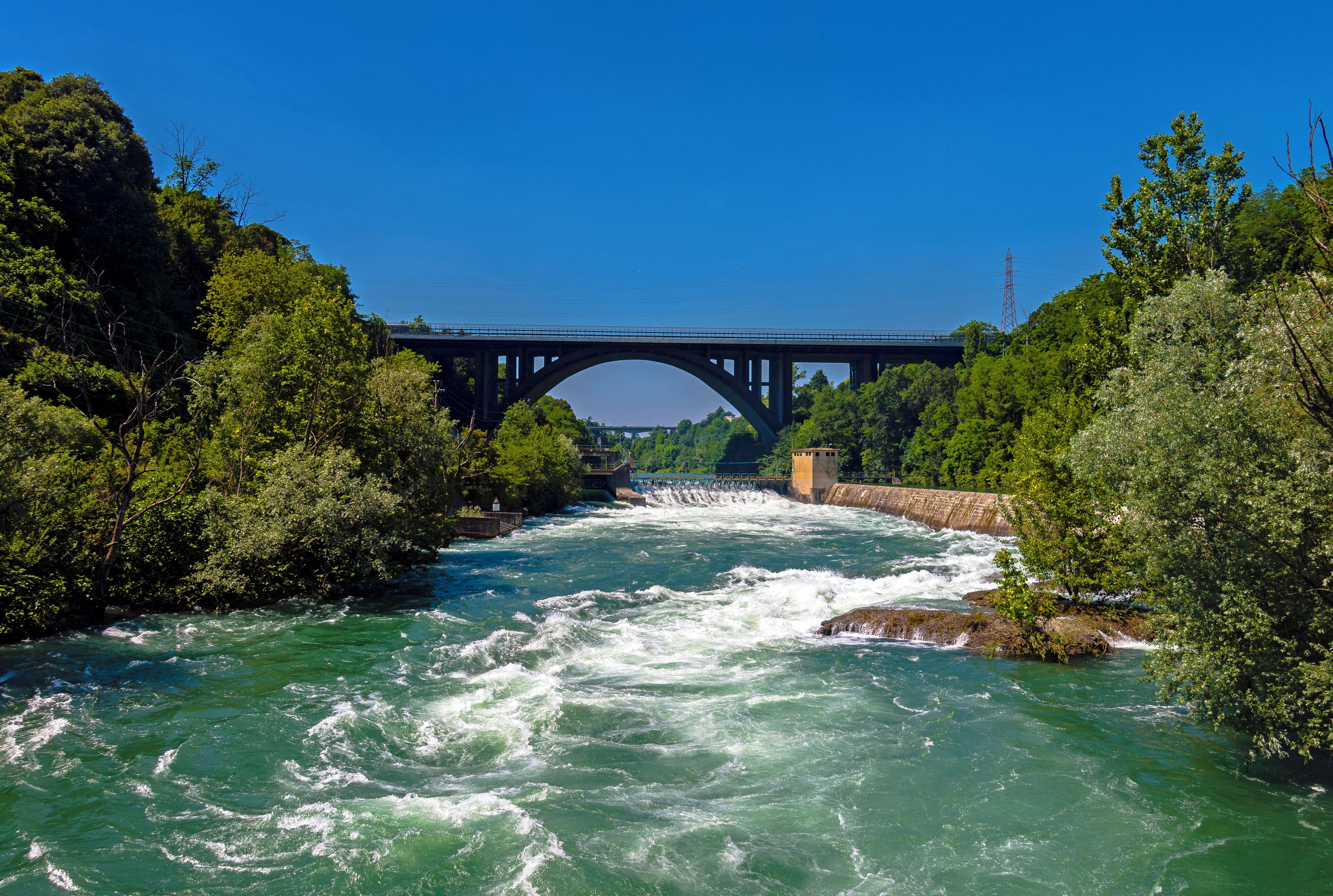 The A4 bridge over the raging Adda river, seen from the footbridge between Trezzo sull'Adda and Crespi d'Adda