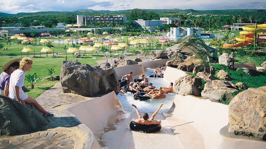 Bela-Bela which includes a water park and rides as well as a large group of people