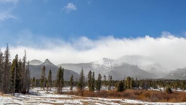 Panoramic view of the mountain range and Saint Catherine's Chapel on the Rock. Church in the Rocky Mountains. Allenspark, Colorado.