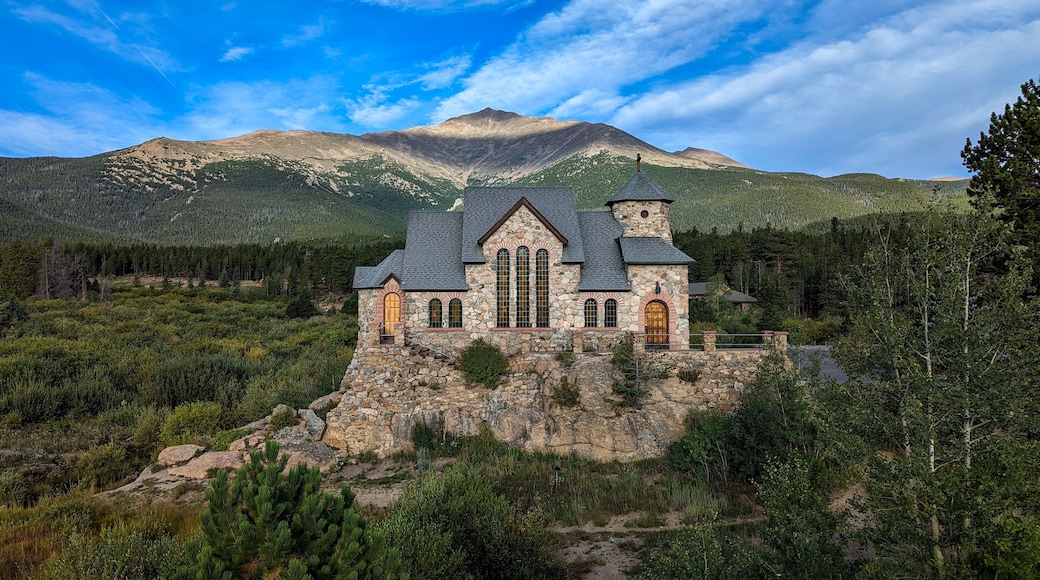 Saint Catherine's Chapel surrounded by dense trees in Allenspark