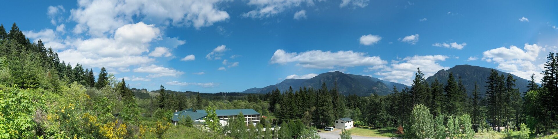 The Bonneville Hot Springs is a what the Romans used to call a Calderium (er...hot spring) surrounded by a luxury resort hotel. This being the Pacific Northwest, where you can't trip over a rock without discovering a trailhead, the resort finds itself situated at the foot of Table Mountain -- one of the premier hikes in the region.
The gravel road you see in the foreground leads back to three fantastic hikes -- Table Mountain, Greenleaf Falls and Aldrich Butte, the last of which has a mile and a half spur leading to a small set of waterfalls.
When you're done for the day, you might consider booking a room and soaking your bones in some of the healing waters. Fair warning, it ain't cheap, and I've never stayed there. But I tucked into the lobby last winter during a bitter wind and kind of fell in love with the place.
I'm bound to book a night or two before long.
In the meantime, I can gaze out from the path to the trailhead and see a panorama like this. That's one of the big perks of this location, and it doesn't cost me a dime.
( #blue )