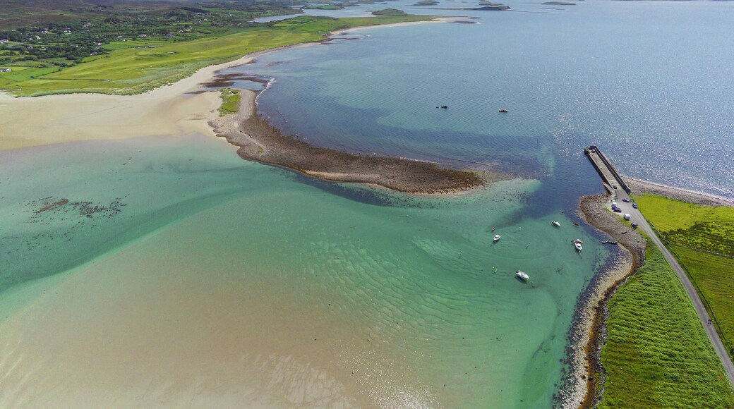 Aerial drone view on a Mulranny pier in county Mayo, Ireland Warm sunny day. Rich saturated blue color of water and sky. Travel and tourism. Irish nature landscape scene.