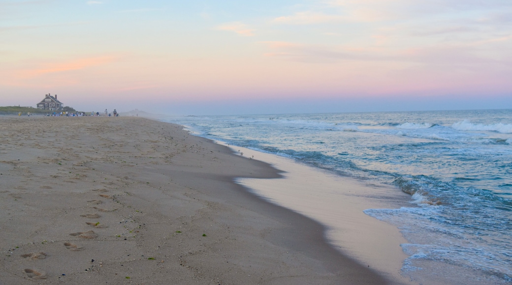 sunset on the beach in the Hamptons with a cotton candy colored sky
