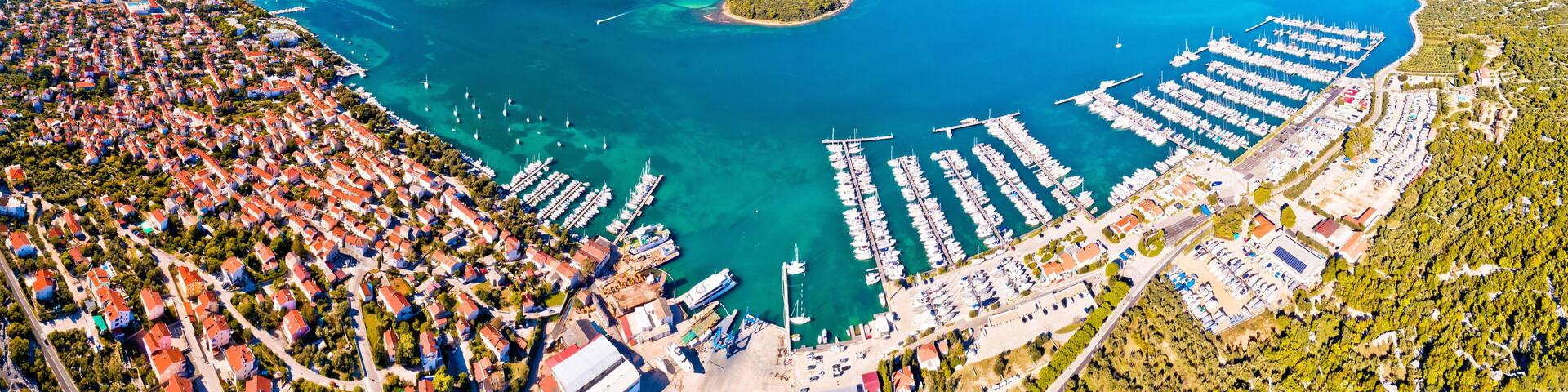 Punat. Town of Punat and monastery island of Kosljun aerial panoramic view