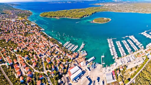 Punat. Town of Punat and monastery island of Kosljun aerial panoramic view