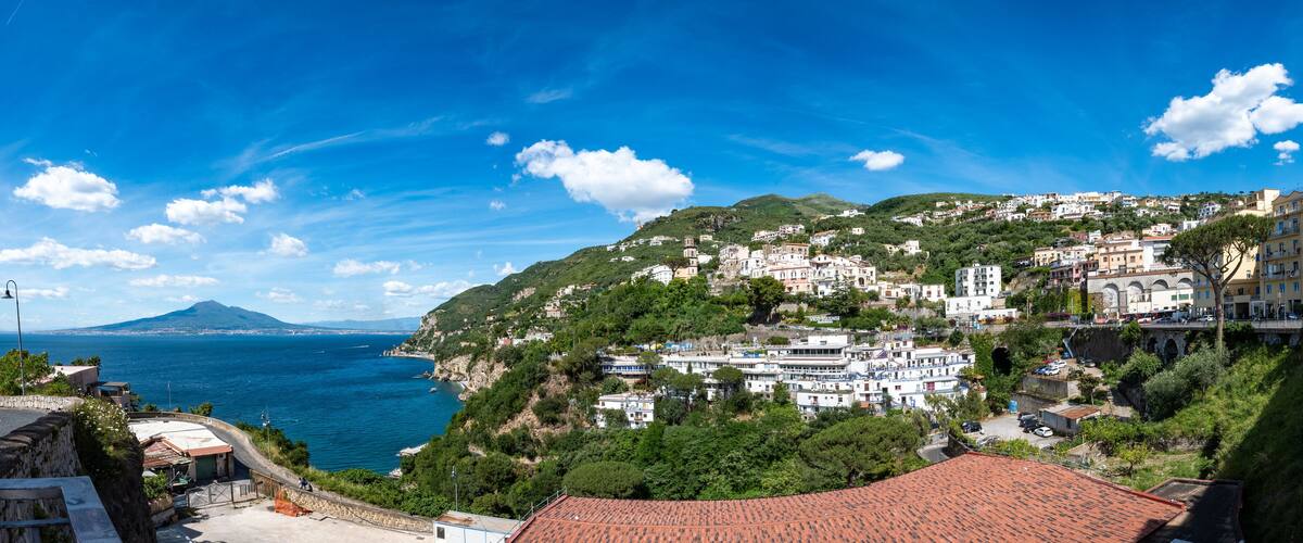 Panoramic view of the city of Vico Equense with Vesuvius and the blue waters of the Gulf of Naples. Italy