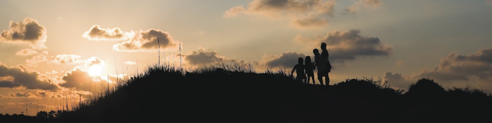 South Padre Island showing hiking or walking and a sunset as well as children