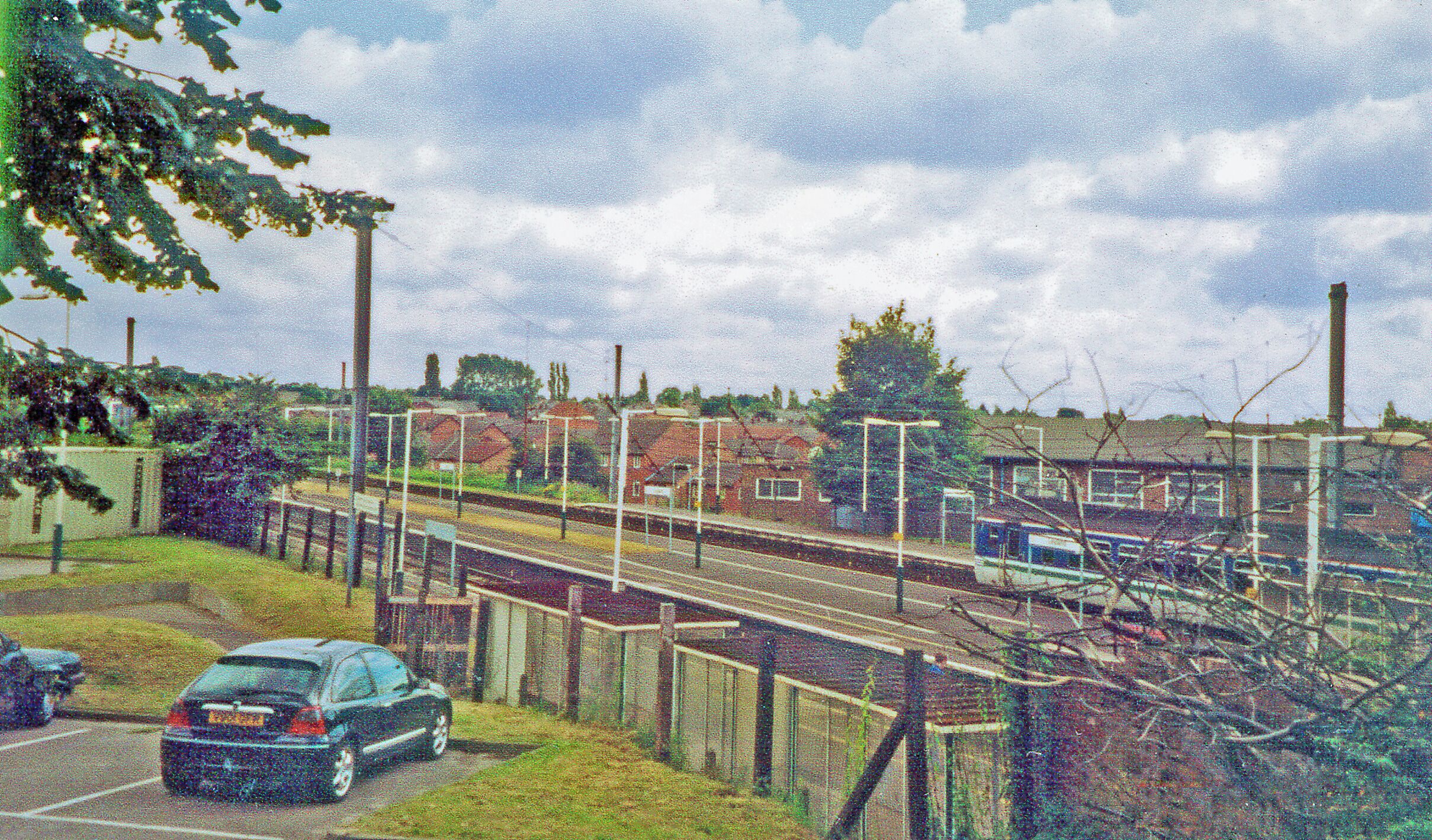 Leyland station, 2002. View southward towards Wigan, Crewe and the South, also Manchester and Liverpool, on the ex-LNWR West Coast Main Line, Crewe - Preston - Lancaster - Carlisle section, electrified 1974.