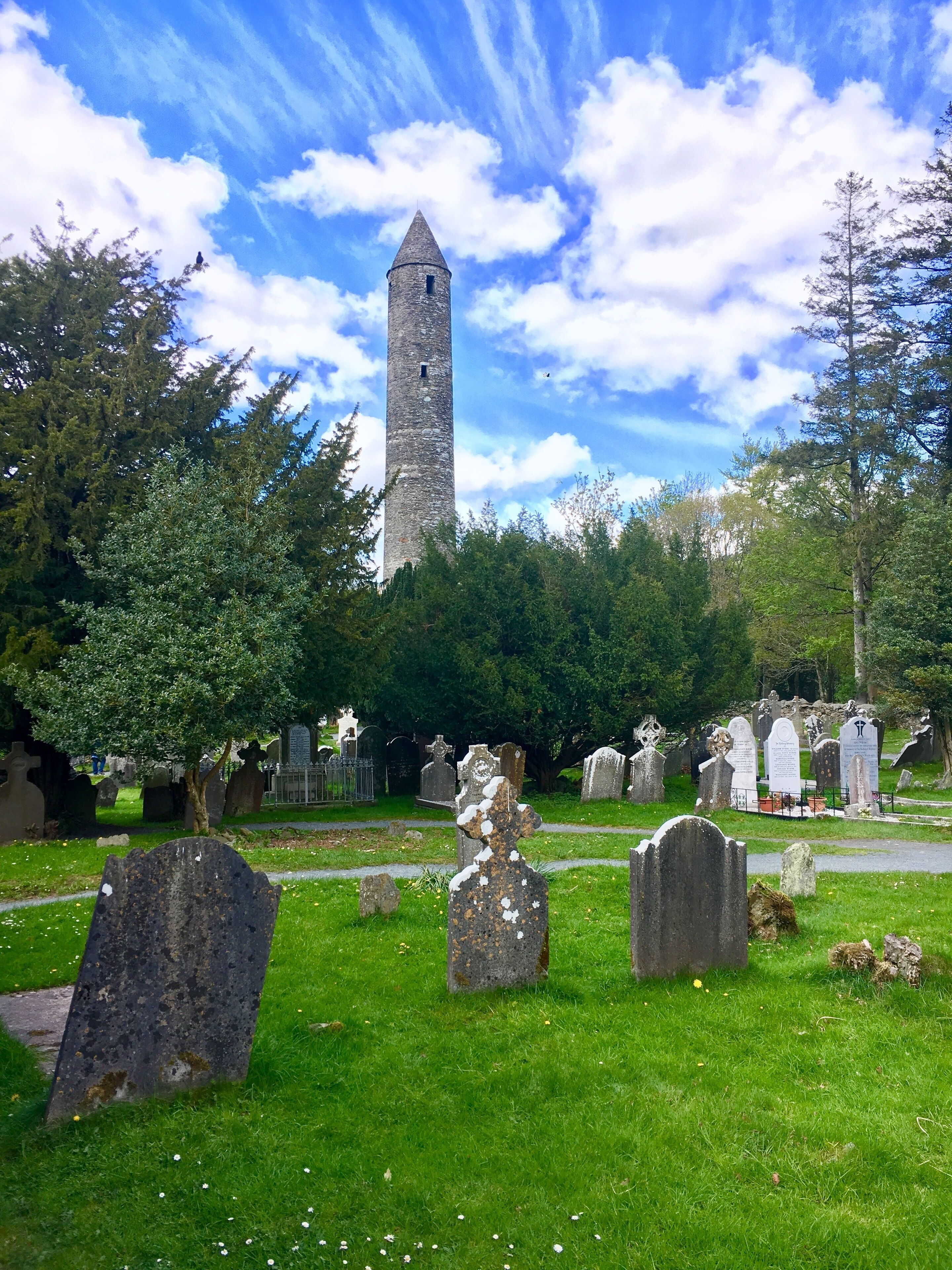 Glendalough is home to one of the most important monastic sites in Ireland. This Christian monastic settlement was founded in the 6th century. Most of the buildings that survive today date from the 10th through 12th centuries, despite attacks by Vikings over the years.

The round tower in the background was built between the year 900 and 1200 AD. It is 100 ft high and had six floors. The entry door is almost 12 feet off the ground and was presumably reached by means of a movable ladder which those inside could pull up after them to prevent an enemy from entering. Round towers were the bell towers of early monasteries and were used to summon monks to prayer. #History