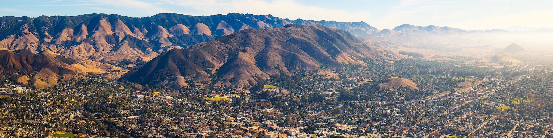 A mountainous landscape with a town nestled in the valley.