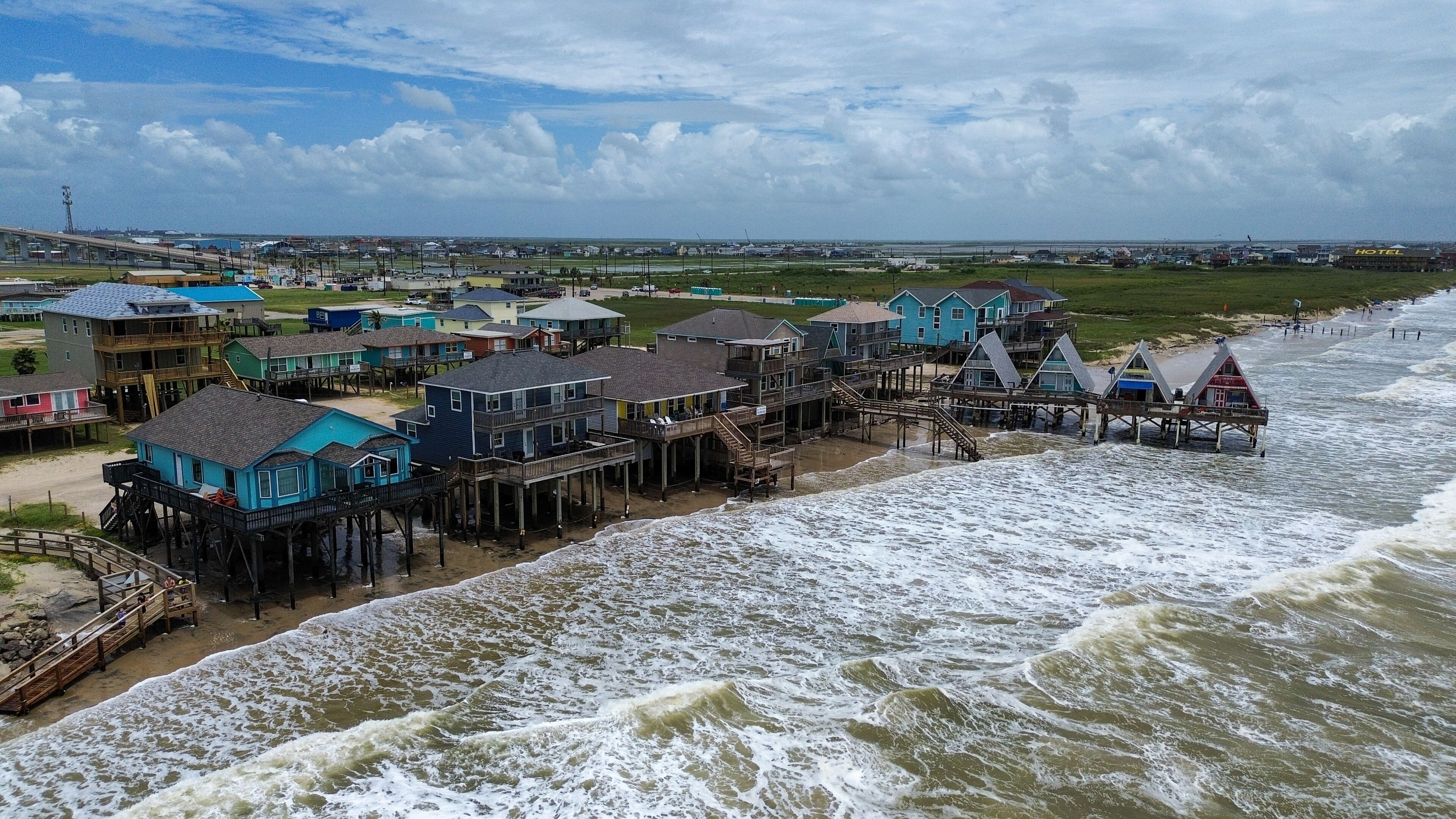 Waves from rough surf crashing onto the barrier island of Galveston, Texas during a tropical system that moved through the area. 