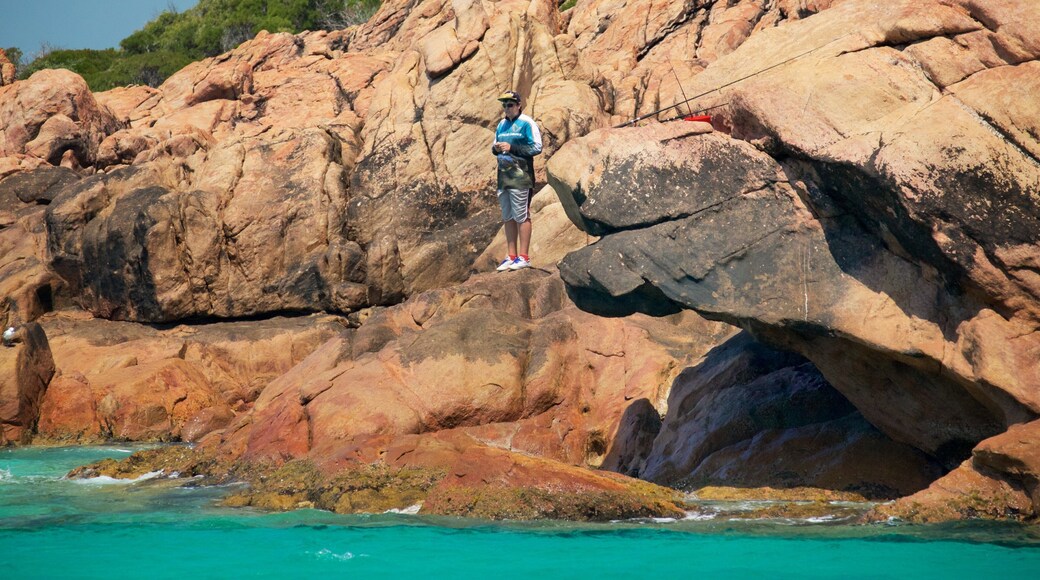 Margaret River Wine Region which includes a bay or harbour and rugged coastline as well as an individual male