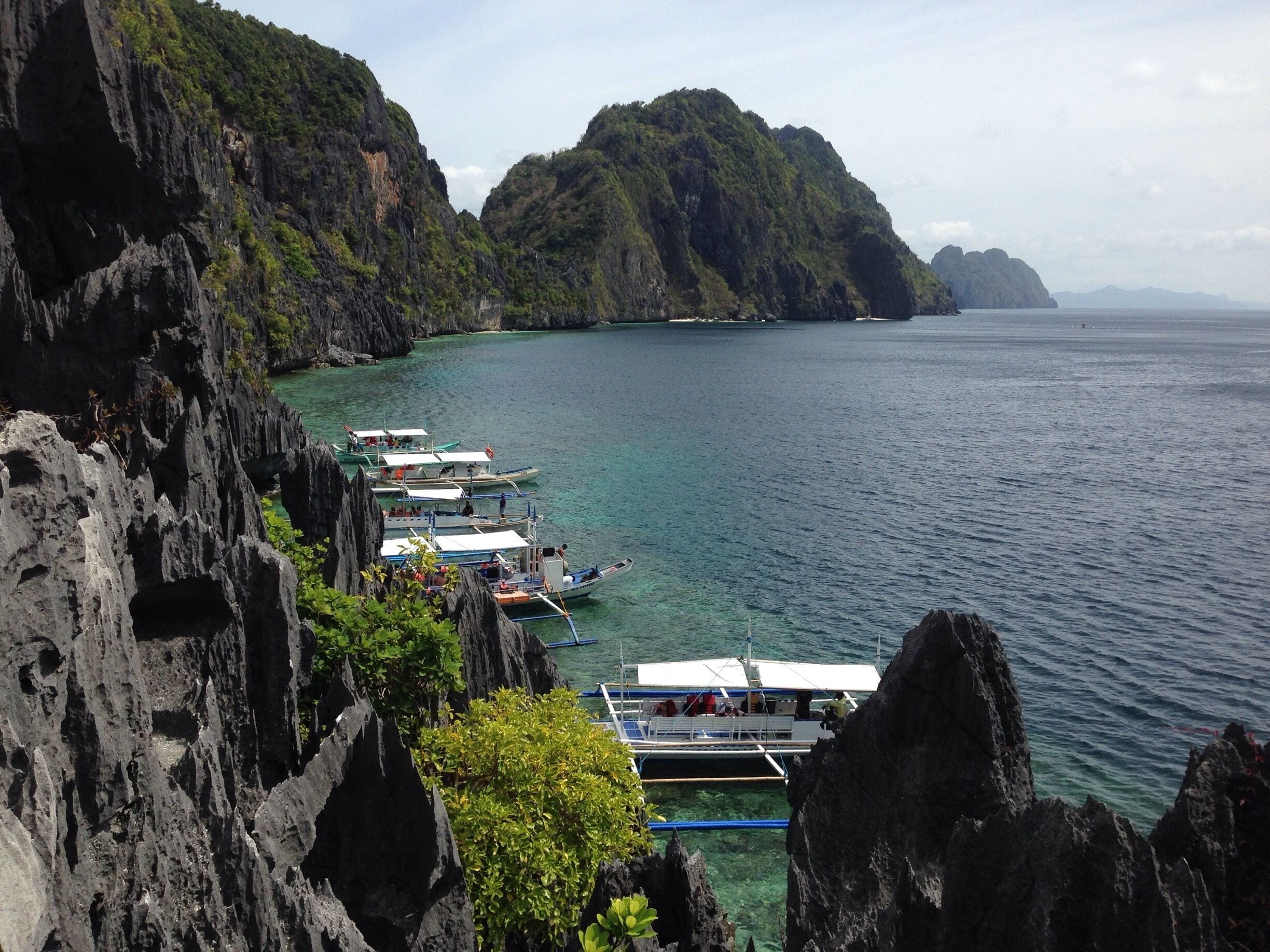 You need to climb on a man made rock stairs to enjoy this beautiful view of the island