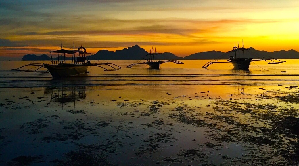 Sunset after a light rain ,passenger "bangkas" resting after another day of touring the islands