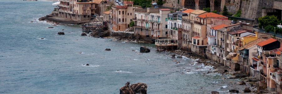 Row of old italian houses fronting the ocean in town Scilla