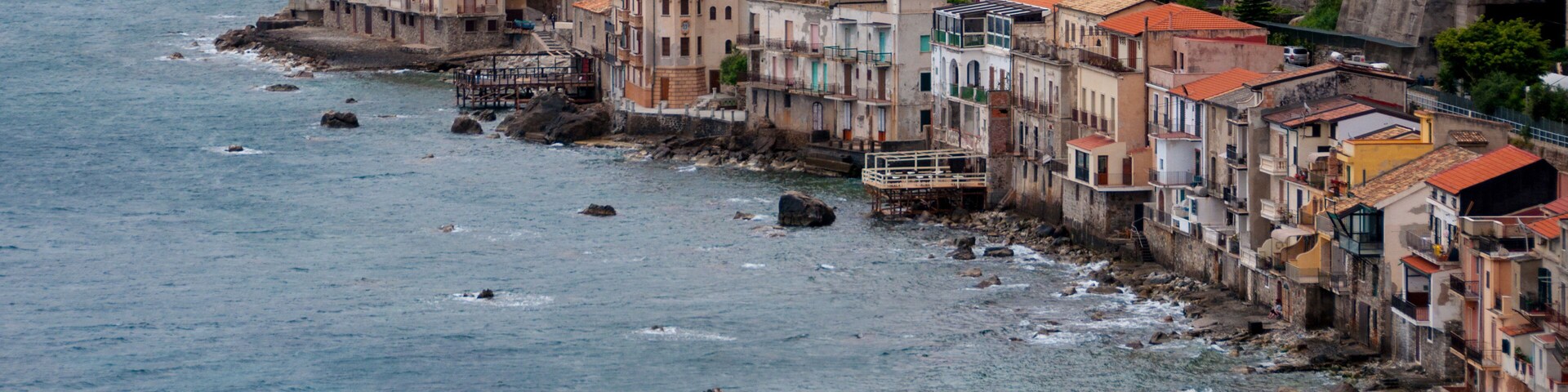 Row of old italian houses fronting the ocean in town Scilla