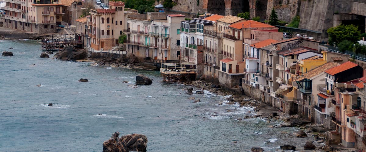 A coastal town with colorful buildings along the waterfront.