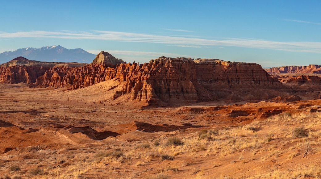 View of Goblin Valley State Park in the San Rafael Swell and the snow capped Henry Mountains in Utah.