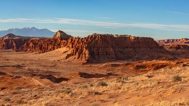 View of Goblin Valley State Park in the San Rafael Swell and the snow capped Henry Mountains in Utah.
