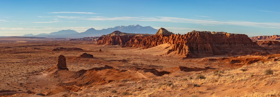 View of Goblin Valley State Park in the San Rafael Swell and the snow capped Henry Mountains in Utah.