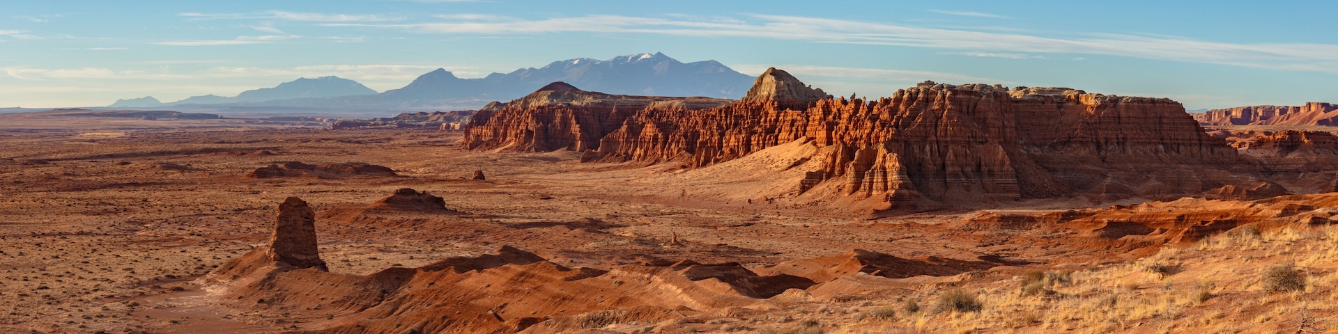 View of Goblin Valley State Park in the San Rafael Swell and the snow capped Henry Mountains in Utah.