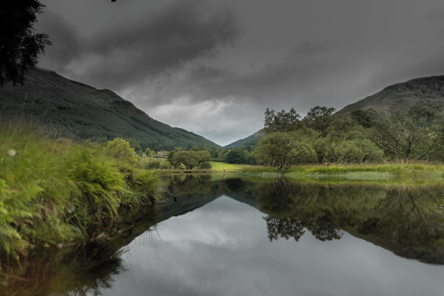 Getting to this location was a rare challenge. I have booked this stay with family and friends on my way to Isle of Skye and didn't arrive to Loch Lomond National Park until nearly midnight. We were told the road has some potholes and arrived in two fully loaded saloon cars as sadly had no other option. The road was truly bad but if we passed it then most of the cars will as well. We didn't get to see the landscape until we have awoken the next morning, although the abundance of stars and a hooting of a tawny owl at 1 am was mesmerising. In the morning the weather was pretty somber but it hasn't taken away the beauty of Loch Voil. I went for a walk alongside the loch but didn't meet anyone at all. Walks at Loch Voil are truly good for the soul.
#reflections #Landscape #britain #uk #Scotland #loch #lake #summer #nature #scottishnature #gooutside #greatoutdoors #visitscotland