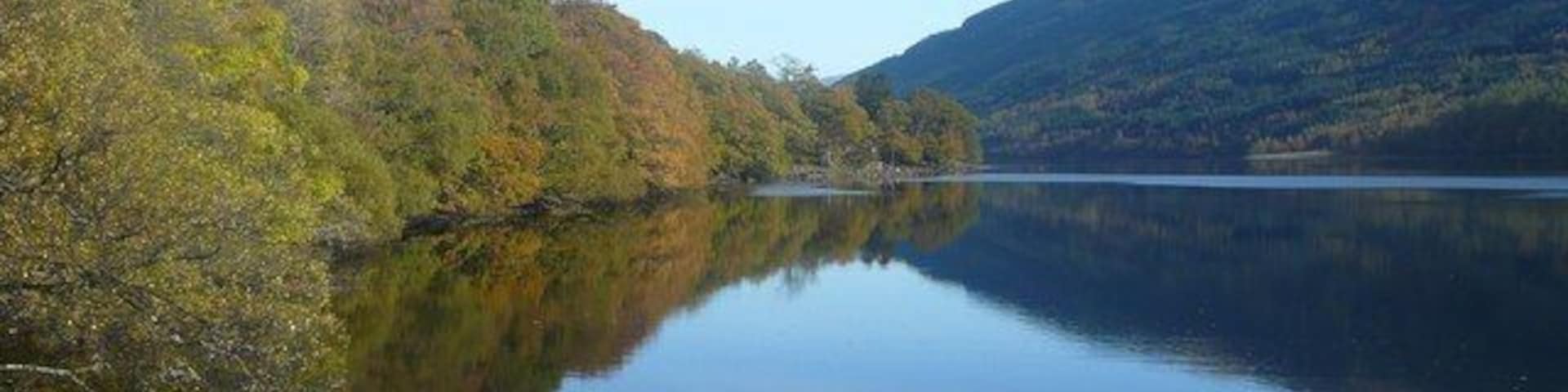 Braes of Balquidder Looking across Loch Voil to the hills on the south side of the Loch. A beautiful autumn day with even the conifers looking attractive - Larch showing clearly in amongst the Sitka Spruce.