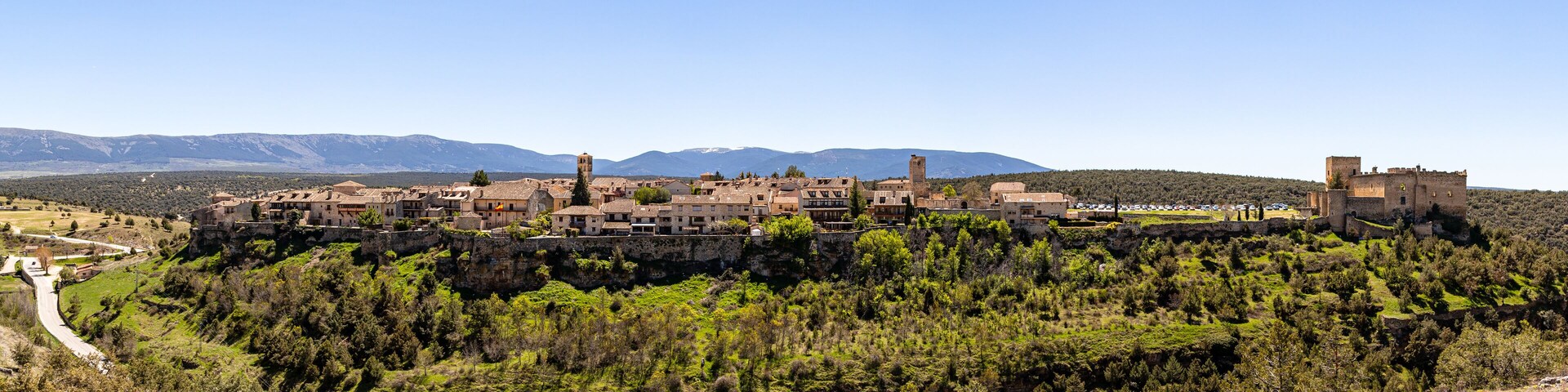 Pedraza, Castilla Y Leon, Spain: panorama of Pedraza village from Mirador the Tungueras, with the Sierra de Guadarrama behind. Pedraza is one of the best preserved medieval villages of Spain