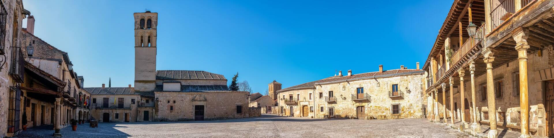 Panoramic view of the main square of the medieval city of Pedraza with its old stone buildings, Segovia, Spain.