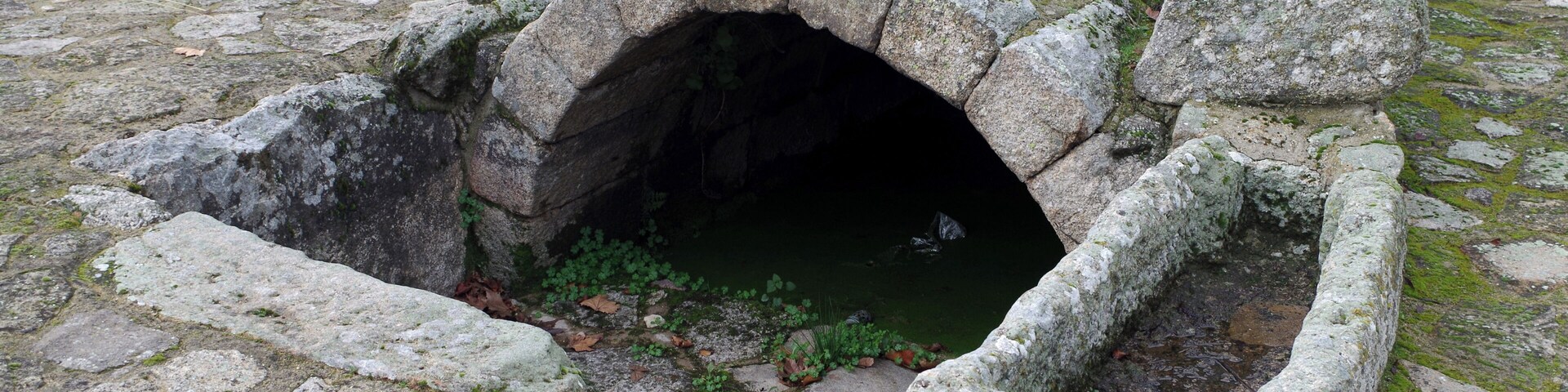 Ancient roman fountain with antropomorphic burial as abreuvoir in Leomil (Guarda, Portugal).