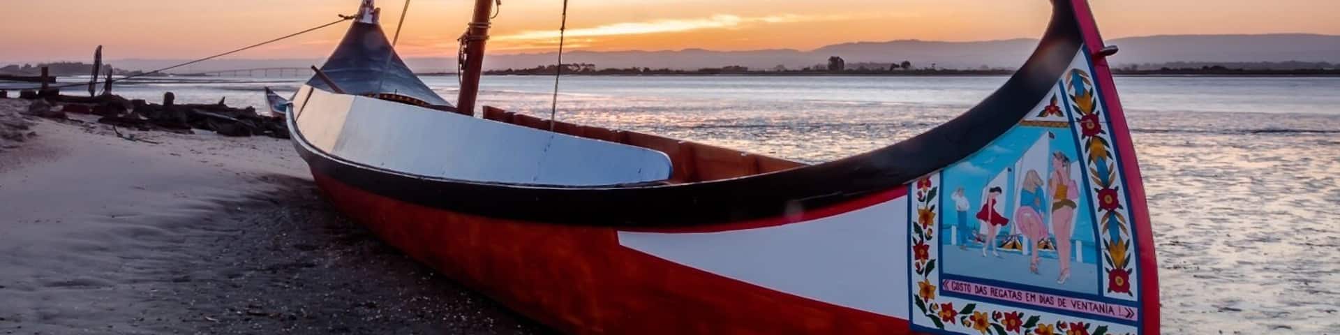Typical Portuguese boats called âmoliceirosâ at sunrise.