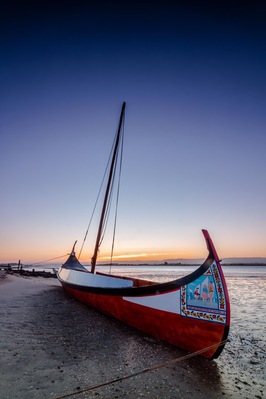 Typical Portuguese boats called “moliceiros” at sunrise.